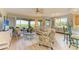 Open living space with ample natural light and access to a balcony at 9711 Sea Turtle Ter # 102, Bradenton, FL 34212