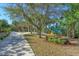 Scenic park with walking path, gazebo, and playground at 9711 Sea Turtle Ter # 102, Bradenton, FL 34212