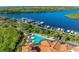 Community pool with marina and boat docks in the background at 9711 Sea Turtle Ter # 102, Bradenton, FL 34212