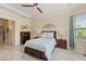 Spacious bedroom with wood flooring and ceiling fan at 9765 Highland Park Pl, Palmetto, FL 34221