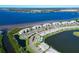 Aerial view of waterfront community with resort-style amenities and parking at 1030 Tidewater Shores Loop # 306, Bradenton, FL 34208