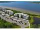 Waterfront condo building with parking and pond views at 1030 Tidewater Shores Loop # 306, Bradenton, FL 34208