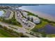 Aerial view of waterfront community with resort-style pool and clubhouse at 1030 Tidewater Shores Loop # 306, Bradenton, FL 34208