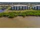 Condo building near the water with lush vegetation at 1030 Tidewater Shores Loop # 306, Bradenton, FL 34208