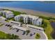 Waterfront condo building with covered parking and lush landscaping at 1030 Tidewater Shores Loop # 306, Bradenton, FL 34208