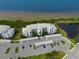 Luxury waterfront condo building with parking and lush landscaping at 1030 Tidewater Shores Loop # 306, Bradenton, FL 34208