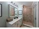 Bathroom with a large mirror, vanity, and walk-in shower at 1030 Tidewater Shores Loop # 306, Bradenton, FL 34208