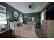 Guest bedroom with queen bed, dresser, and coastal decor at 1030 Tidewater Shores Loop # 306, Bradenton, FL 34208
