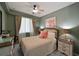 Bedroom with a queen-size bed and coastal decor at 1030 Tidewater Shores Loop # 306, Bradenton, FL 34208