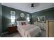 Guest bedroom with a queen-size bed and coastal decor at 1030 Tidewater Shores Loop # 306, Bradenton, FL 34208