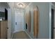 Bright entryway with decorative surfboards and tiled floor at 1030 Tidewater Shores Loop # 306, Bradenton, FL 34208