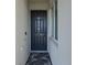 Inviting entryway with a dark-colored door and a welcome mat at 1030 Tidewater Shores Loop # 306, Bradenton, FL 34208