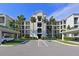Three-story building with covered parking and landscaping at 1030 Tidewater Shores Loop # 306, Bradenton, FL 34208