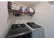 Convenient laundry room with Samsung washer and dryer, and overhead shelving at 1030 Tidewater Shores Loop # 306, Bradenton, FL 34208