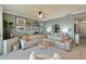 Spacious living room with sectional sofa and coastal decor. Water views at 1030 Tidewater Shores Loop # 306, Bradenton, FL 34208