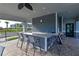 Outdoor kitchen with bar seating and grilling station at 1030 Tidewater Shores Loop # 306, Bradenton, FL 34208