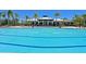 Refreshing community pool with spacious deck and lounge chairs at 1030 Tidewater Shores Loop # 306, Bradenton, FL 34208