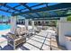 Resort-style pool area with pergola, fireplace, and seating at 1030 Tidewater Shores Loop # 306, Bradenton, FL 34208