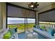 Relaxing screened balcony with waterfront views and comfy seating at 1030 Tidewater Shores Loop # 306, Bradenton, FL 34208
