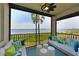 Relaxing screened balcony overlooking waterfront with comfy seating at 1030 Tidewater Shores Loop # 306, Bradenton, FL 34208