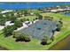 Four well-maintained tennis courts with shade structures at 1030 Tidewater Shores Loop # 306, Bradenton, FL 34208