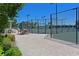 Well-maintained tennis courts with seating area nearby at 1030 Tidewater Shores Loop # 306, Bradenton, FL 34208