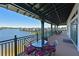 Community deck overlooking the marina with tables and chairs at 1030 Tidewater Shores Loop # 306, Bradenton, FL 34208