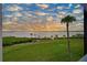 Scenic waterfront view with lush greenery and sunset at 1030 Tidewater Shores Loop # 306, Bradenton, FL 34208