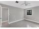 Simple bedroom with ceiling fan and carpet at 104 24Th Ne St, Bradenton, FL 34208