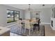 Bright dining room with farmhouse table and stylish light fixture at 104 24Th Ne St, Bradenton, FL 34208