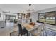 Open concept dining area with view into kitchen and living areas at 104 24Th Ne St, Bradenton, FL 34208