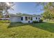 Ranch house with modern updates and green lawn at 104 24Th Ne St, Bradenton, FL 34208