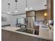 Modern kitchen with stainless steel appliances and wood cabinets at 104 24Th Ne St, Bradenton, FL 34208