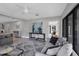 Living room with a sofa and view into the kitchen at 104 24Th Ne St, Bradenton, FL 34208