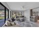 Open living area with sofas and access to kitchen and backyard at 104 24Th Ne St, Bradenton, FL 34208