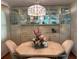 Bright dining area with built-in hutch and light fixture at 1111 42Nd E Ave, Ellenton, FL 34222