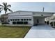 Single-wide manufactured home with carport and landscaping at 1111 42Nd E Ave, Ellenton, FL 34222
