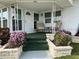 Covered porch with seating and potted plants at 1111 42Nd E Ave, Ellenton, FL 34222