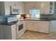 Efficient kitchen with white cabinets and appliances at 1111 42Nd E Ave, Ellenton, FL 34222