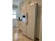 Kitchen features a large refrigerator and ample cabinetry at 1111 42Nd E Ave, Ellenton, FL 34222