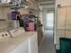 Laundry room with washer, dryer, and storage shelves at 1111 42Nd E Ave, Ellenton, FL 34222