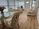 Bright sunroom with wicker furniture and glass table at 1111 42Nd E Ave, Ellenton, FL 34222