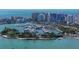 Breathtaking aerial view of a luxury waterfront condo overlooking a marina filled with boats at 1111 N Gulfstream Ave # 4E, Sarasota, FL 34236