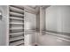 Walk-in closet featuring custom shelving and ample storage for organized living at 1111 N Gulfstream Ave # 4E, Sarasota, FL 34236
