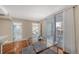 Open dining area with glass table, natural light, and sliding doors to the outdoor balcony space at 1111 N Gulfstream Ave # 4E, Sarasota, FL 34236