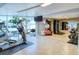 Fitness center with various exercise equipment, including ellipticals and weights at 1111 N Gulfstream Ave # 4E, Sarasota, FL 34236