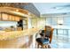 Community kitchen features granite counters, stainless steel appliances, and wood cabinets at 1111 N Gulfstream Ave # 4E, Sarasota, FL 34236