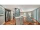 Open kitchen with stainless steel appliances, granite counters and a modern design at 1111 N Gulfstream Ave # 4E, Sarasota, FL 34236