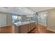 Open kitchen with a breakfast bar and stainless appliances at 1111 N Gulfstream Ave # 4E, Sarasota, FL 34236