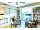 Relaxing community library with comfortable seating and large windows overlooking a pool at 1111 N Gulfstream Ave # 4E, Sarasota, FL 34236